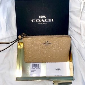 Coach debossed signature wristlet nib
